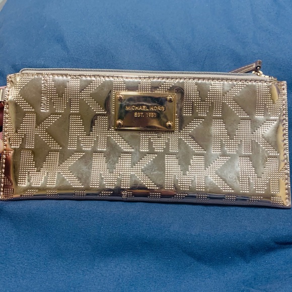 Micheal Kors rose gold clutch with strap